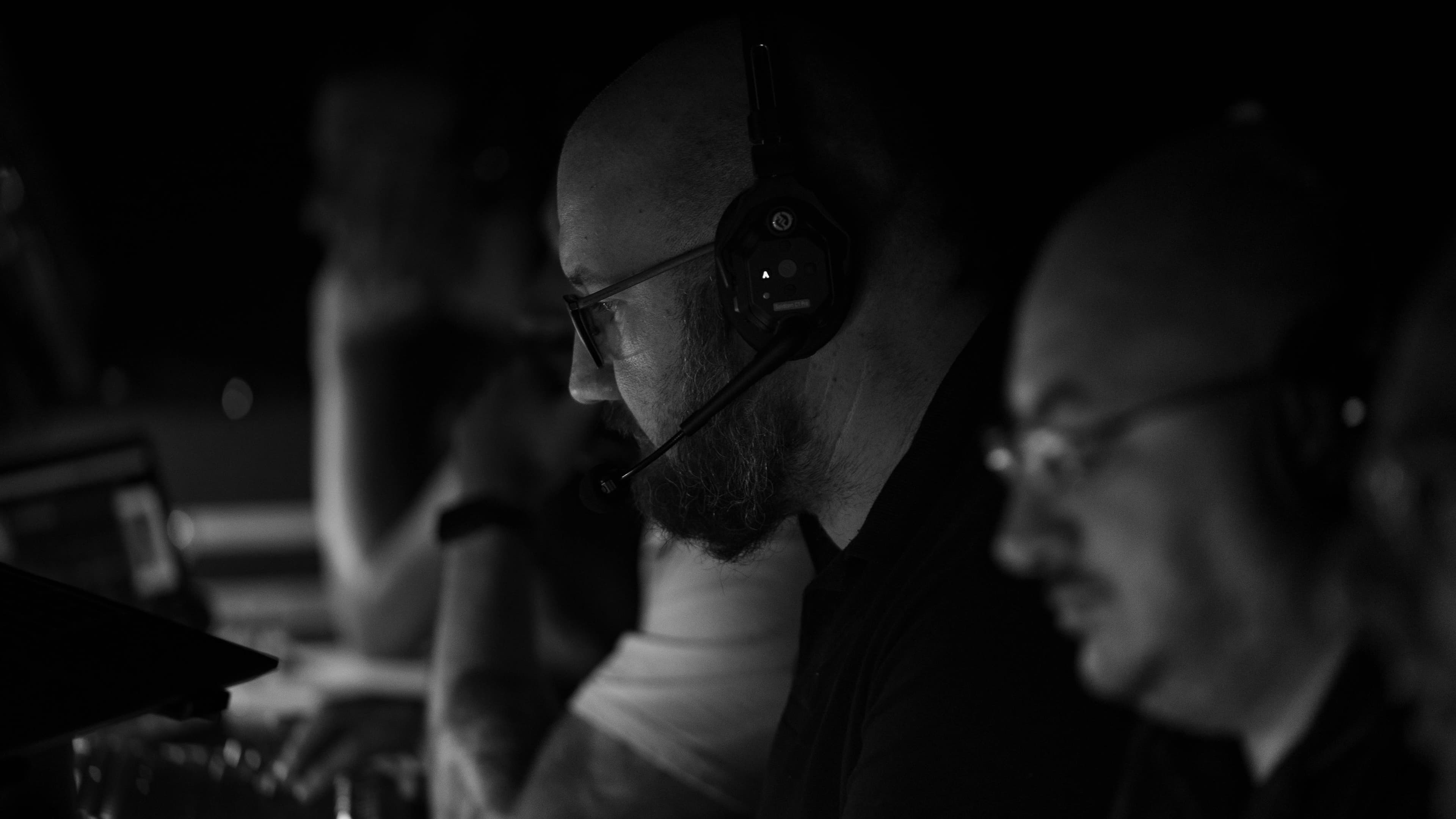 Headset on, focused on the live feed